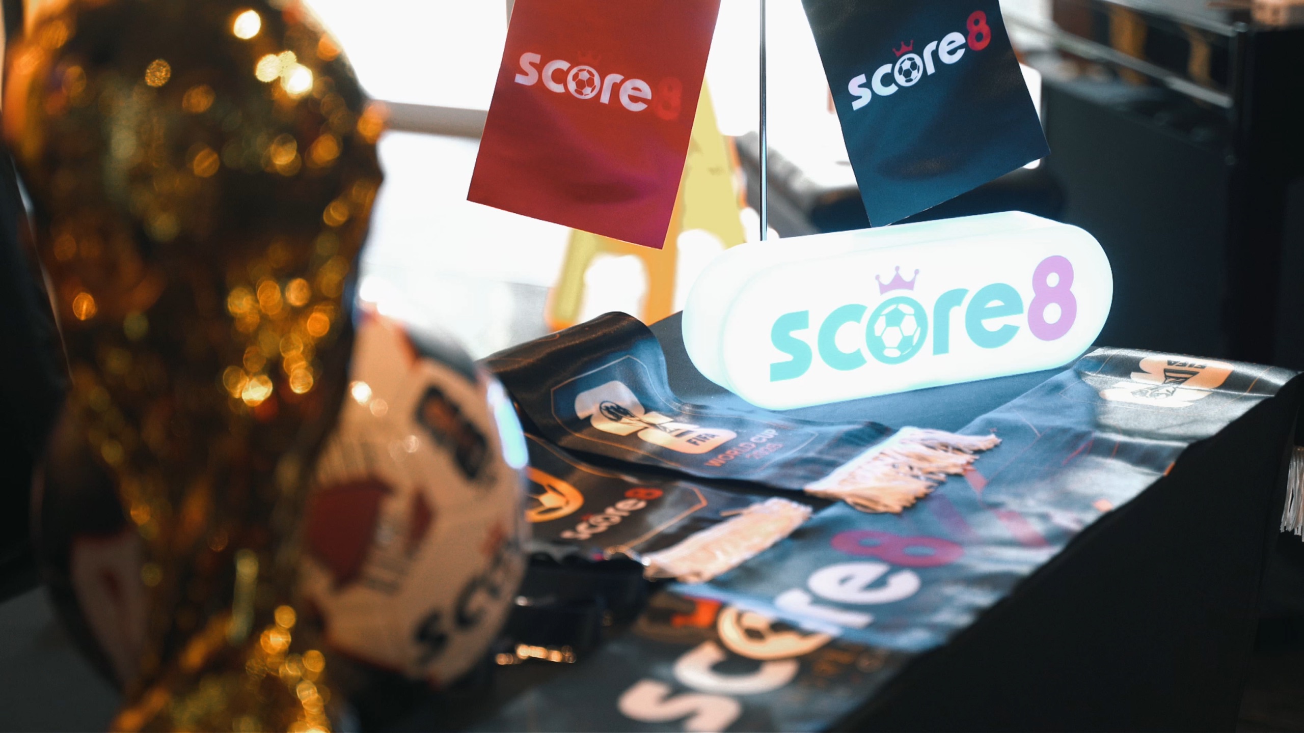 Score8 illuminated sign and branded event merchandise